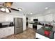 Bright kitchen featuring white cabinets, granite countertops, stainless steel appliances, and tile flooring at 1640 W Gail Dr, Chandler, AZ 85224