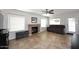 Bright living room features tile floors, ceiling fan, fireplace, and neutral paint at 1640 W Gail Dr, Chandler, AZ 85224