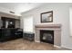 Living room with fireplace, tile flooring, TV and console at 1640 W Gail Dr, Chandler, AZ 85224