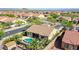 A stunning aerial view showcases a desert home with a private pool in a vibrant community at 18108 W Thunderhill Pl, Goodyear, AZ 85338