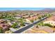 Expansive neighborhood featuring desert landscaping, tile roofs, and mountain views at 18108 W Thunderhill Pl, Goodyear, AZ 85338