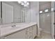 Bright bathroom with large vanity and glass shower stall at 18108 W Thunderhill Pl, Goodyear, AZ 85338