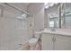 Clean bathroom featuring a glass-enclosed shower and neutral vanity at 18108 W Thunderhill Pl, Goodyear, AZ 85338