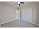 Comfortable bedroom features a ceiling fan and large closet at 18108 W Thunderhill Pl, Goodyear, AZ 85338