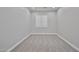 Clean, carpeted bedroom with a window and neutral decor at 18108 W Thunderhill Pl, Goodyear, AZ 85338