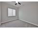 Comfortable bedroom with large window that provides plenty of natural light at 18108 W Thunderhill Pl, Goodyear, AZ 85338