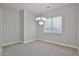 Cozy dining room featuring a modern chandelier and a bright window, ideal for Gathering gatherings at 18108 W Thunderhill Pl, Goodyear, AZ 85338