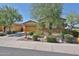 Charming single-Gathering home with desert landscaping, rocks, and beautiful trees at 18108 W Thunderhill Pl, Goodyear, AZ 85338