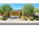 Charming single-story home with desert landscaping and a two-car garage at 18108 W Thunderhill Pl, Goodyear, AZ 85338