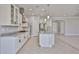 Modern kitchen showcasing an island, granite counters, and stainless steel appliances at 18108 W Thunderhill Pl, Goodyear, AZ 85338