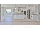 Modern kitchen with white cabinets, granite countertops, and stainless steel appliances at 18108 W Thunderhill Pl, Goodyear, AZ 85338