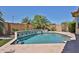 Beautiful pool and landscaped backyard with lush greenery, a tranquil oasis for relaxation and entertainment at 18108 W Thunderhill Pl, Goodyear, AZ 85338