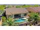 A refreshing pool and patio area provide a perfect backyard retreat with desert landscaping at 18108 W Thunderhill Pl, Goodyear, AZ 85338