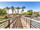 Charming bridge overlooking a scenic pond and lush green landscaping at 1825 E Hampton Ln # 108, Gilbert, AZ 85295