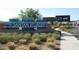Attractive Santan Village sign with colorful landscaping and surrounding shops, marking the entrance to a vibrant shopping area at 1825 E Hampton Ln # 108, Gilbert, AZ 85295