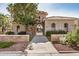 Elegant community entrance with stone accents, arched gate, and manicured landscaping, creating a welcoming first impression at 1825 E Hampton Ln # 108, Gilbert, AZ 85295