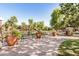 Inviting community park featuring benches, decorative planters, and mature trees, perfect for relaxation and social gatherings at 1825 E Hampton Ln # 108, Gilbert, AZ 85295