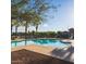 Sparkling community pool with ample deck space, inviting residents to enjoy outdoor recreation and relaxation under the sun at 1825 E Hampton Ln # 108, Gilbert, AZ 85295