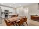 Dining area adjacent to kitchen with stylish table and comfortable seating at 1825 E Hampton Ln # 108, Gilbert, AZ 85295