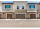 Inviting townhouse exteriors featuring private garages and manicured surroundings at 1825 E Hampton Ln # 108, Gilbert, AZ 85295