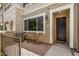 Charming front patio with brick pavers and seating area near the entrance at 1825 E Hampton Ln # 108, Gilbert, AZ 85295