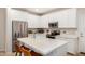 Modern kitchen with white cabinetry, stainless steel appliances, and quartz countertops at 1825 E Hampton Ln # 108, Gilbert, AZ 85295