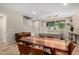 Open-concept living and dining area with modern furnishings and fixtures at 1825 E Hampton Ln # 108, Gilbert, AZ 85295