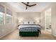 Cozy main bedroom with carpet, ceiling fan, and natural light at 1825 E Hampton Ln # 108, Gilbert, AZ 85295