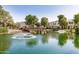 Picturesque pond with a fountain, green algae, and lush landscaping at 1825 E Hampton Ln # 108, Gilbert, AZ 85295