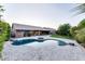 Beautiful backyard showcasing a private pool, fire pit, and stone patio, perfect for outdoor relaxation and entertainment at 1849 S 96Th St, Mesa, AZ 85209