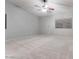 Spacious bedroom with plush carpet, a ceiling fan, window blinds, and neutral walls at 1849 S 96Th St, Mesa, AZ 85209