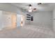 Spacious bedroom featuring a ceiling fan, neutral tones, and a convenient access to the walk-in closet at 1849 S 96Th St, Mesa, AZ 85209