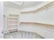 Walk-in closet with ample shelving and rod space for organized storage of clothes and accessories at 1849 S 96Th St, Mesa, AZ 85209