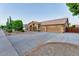 Expansive property with a three-car garage, desert landscaping, and wide driveway at 1849 S 96Th St, Mesa, AZ 85209