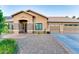 Charming single-story home featuring a three-car garage and desert landscaping at 1849 S 96Th St, Mesa, AZ 85209