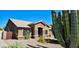 Beautiful desert home featuring stone accents and desert landscaping at 1849 S 96Th St, Mesa, AZ 85209