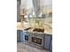 Gourmet kitchen featuring a stainless steel range, hood, pot filler, and marble backsplash at 1849 S 96Th St, Mesa, AZ 85209
