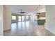 Open-concept living area with modern flooring, natural light, and kitchen with island at 1849 S 96Th St, Mesa, AZ 85209