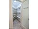 Walk-in pantry with shelving, frosted glass door, and tile floors at 1849 S 96Th St, Mesa, AZ 85209