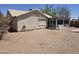 Backyard view with desert landscape and screened patio with plenty of space at 1918 S Ocotillo Dr, Apache Junction, AZ 85120