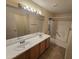 Bathroom features a double sink vanity with a large mirror and a shower/tub combo at 1918 S Ocotillo Dr, Apache Junction, AZ 85120