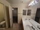 Bathroom featuring a dual sink vanity and a toilet, conveniently located near the bedroom at 1918 S Ocotillo Dr, Apache Junction, AZ 85120