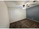 Bedroom featuring carpeted floors, a ceiling fan, and window at 1918 S Ocotillo Dr, Apache Junction, AZ 85120