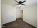 Carpeted bedroom featuring a ceiling fan and closet at 1918 S Ocotillo Dr, Apache Junction, AZ 85120