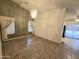 Elegant dining room featuring tile floors, stylish light fixture, and a view of the kitchen area at 1918 S Ocotillo Dr, Apache Junction, AZ 85120