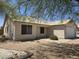 Lovely single-story home featuring a well-manicured front yard, desert landscaping and a two-car garage at 1918 S Ocotillo Dr, Apache Junction, AZ 85120