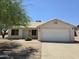 Charming single-story home featuring a well-manicured front yard and a two-car garage at 1918 S Ocotillo Dr, Apache Junction, AZ 85120