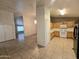 Spacious kitchen and dining area offers tile floors, ample counter space, and white appliances at 1918 S Ocotillo Dr, Apache Junction, AZ 85120