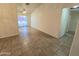 Open-concept living room featuring tile flooring, neutral walls, and sliding glass door access to the outside at 1918 S Ocotillo Dr, Apache Junction, AZ 85120