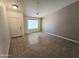 Open-concept living room with tile flooring, neutral paint and natural light at 1918 S Ocotillo Dr, Apache Junction, AZ 85120